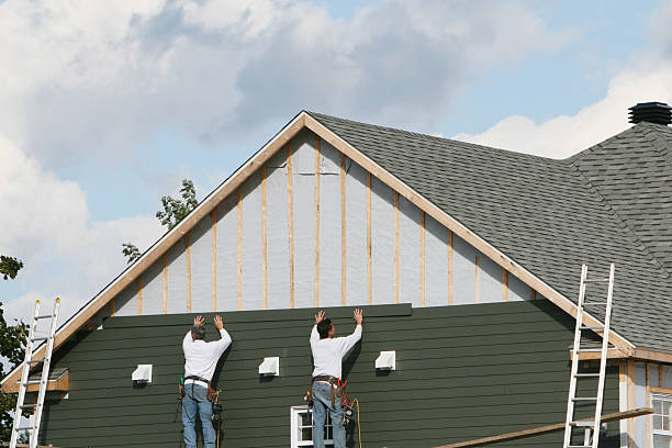 Professional Siding technician working in Northfield, KY